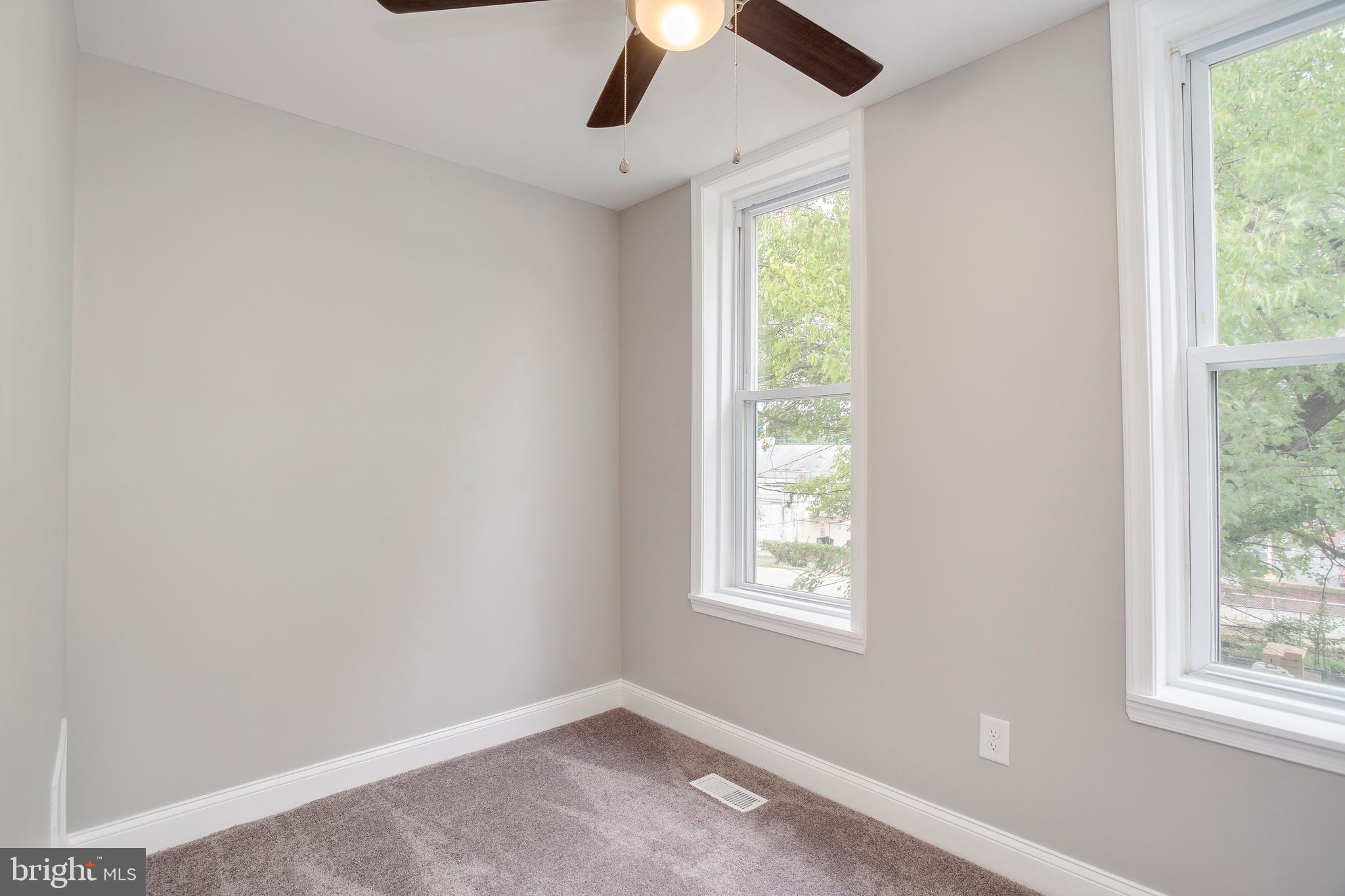 210 South Loudon Avenue Baltimore, MD 21229 - Photo 15 of 28 Large windows allow natural light into the home.