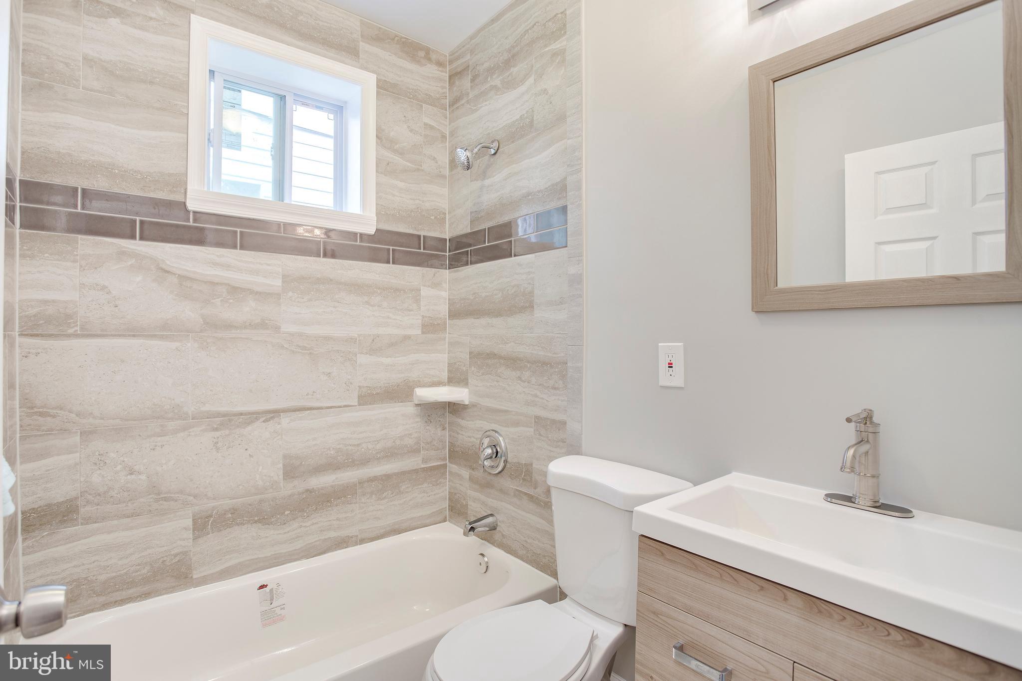 210 South Loudon Avenue Baltimore, MD 21229 - Photo 17 of 28 Relax in the brand new bathroom tub.