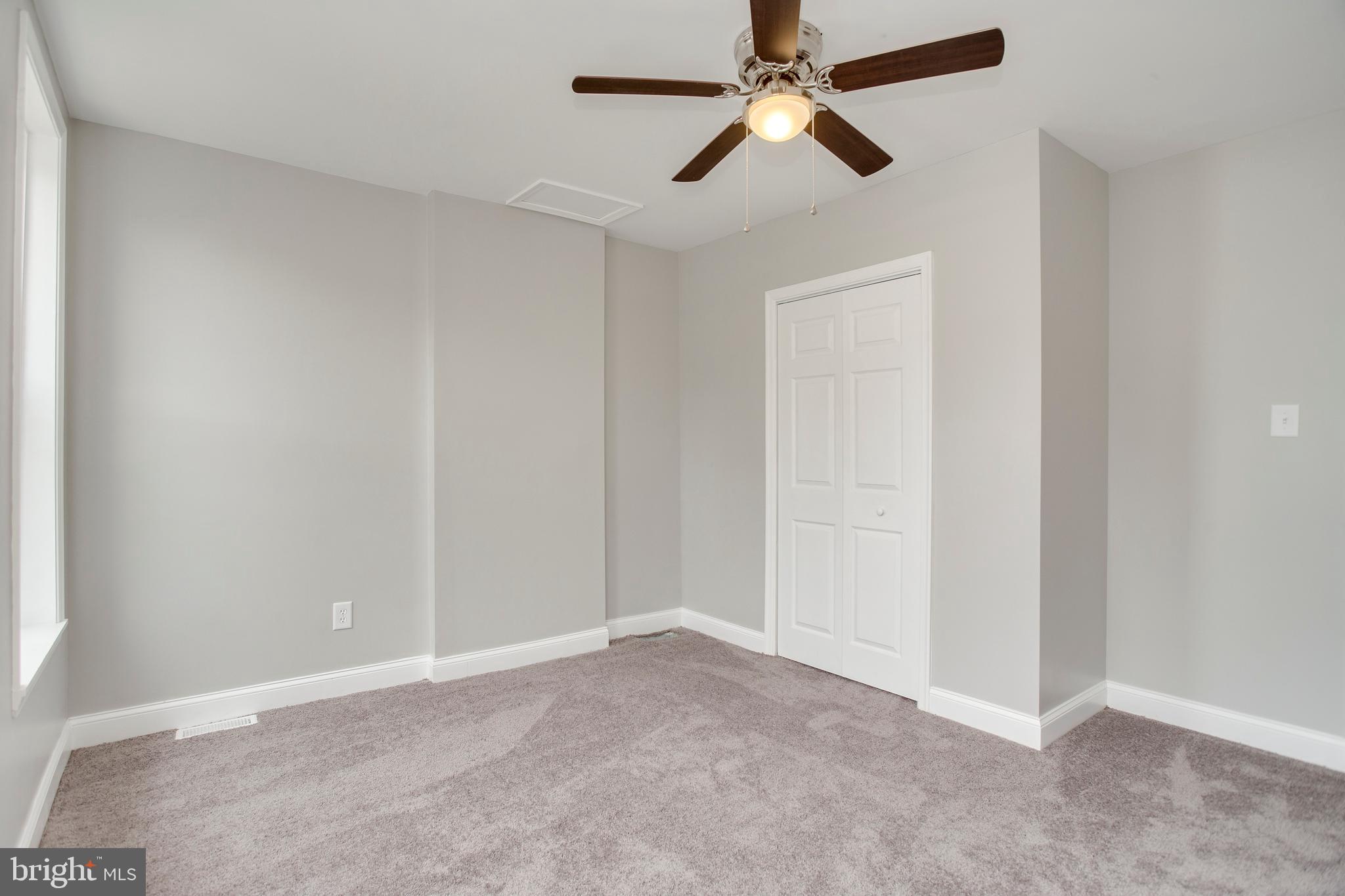 210 South Loudon Avenue Baltimore, MD 21229 - Photo 21 of 28 Relax in the spacious master bedroom.
