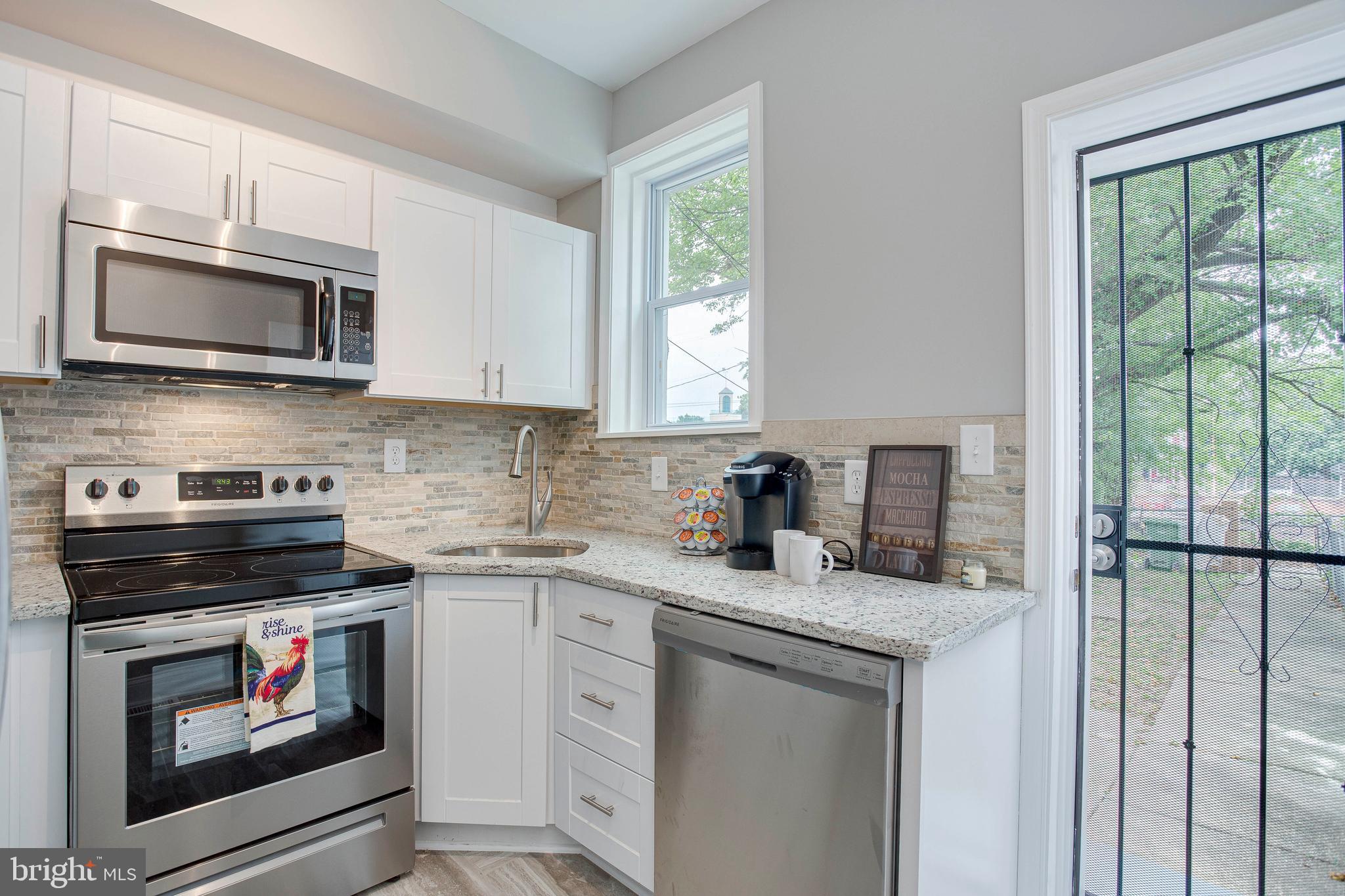 210 South Loudon Avenue Baltimore, MD 21229 - Photo 26 of 28 Enjoy the dishwasher and access to the backyard.