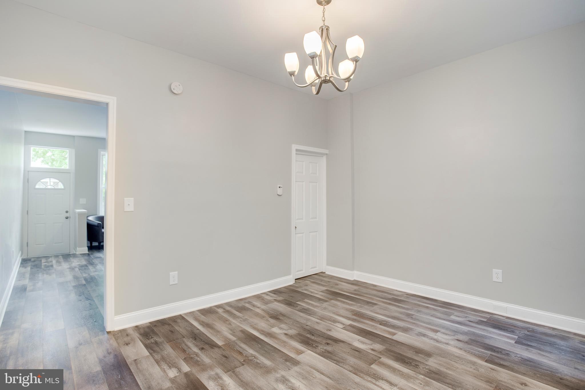 210 South Loudon Avenue Baltimore, MD 21229 - Photo 8 of 28 Formal dining room with new light fixture.