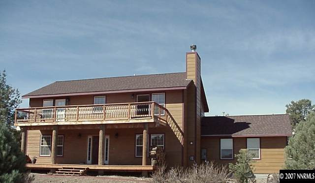 21885 Adobe Road Reno, NV 89521 - Photo 1 of 9 a front view of a house with a garden