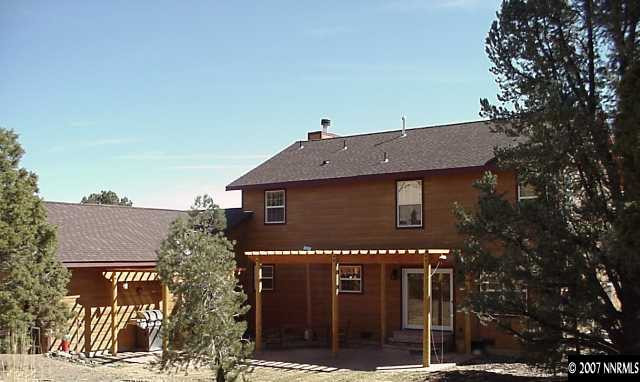 21885 Adobe Road Reno, NV 89521 - Photo 2 of 9 a front view of a house with a yard