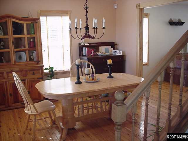 21885 Adobe Road Reno, NV 89521 - Photo 6 of 9 a view of a dining room with furniture window and wooden floor