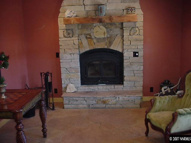 21885 Adobe Road Reno, NV 89521 - Photo 7 of 9 a living room with furniture and a fireplace