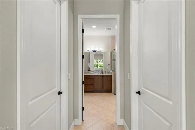 a view of a bathroom from a hallway
