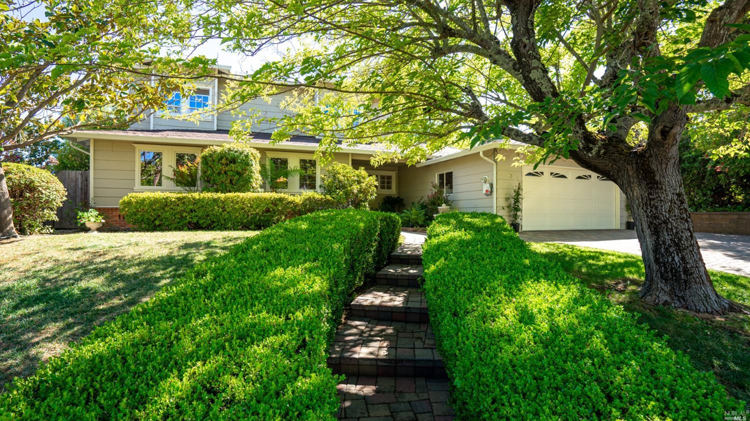 73 Esmeyer Drive San Rafael, CA 94903 - Photo 1 of 1 a front view of a house with garden