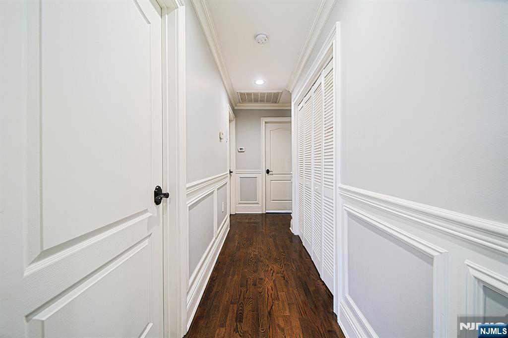 897 Virgil Avenue Ridgefield, NJ 07657 - Photo 38 of 50 a view of a hallway with wooden floor