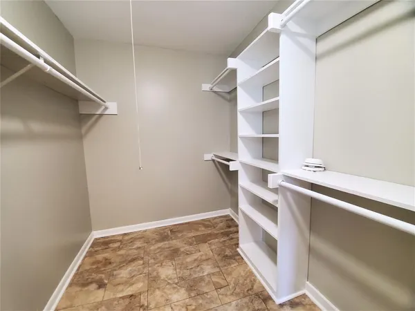 a view of an empty walk in closet