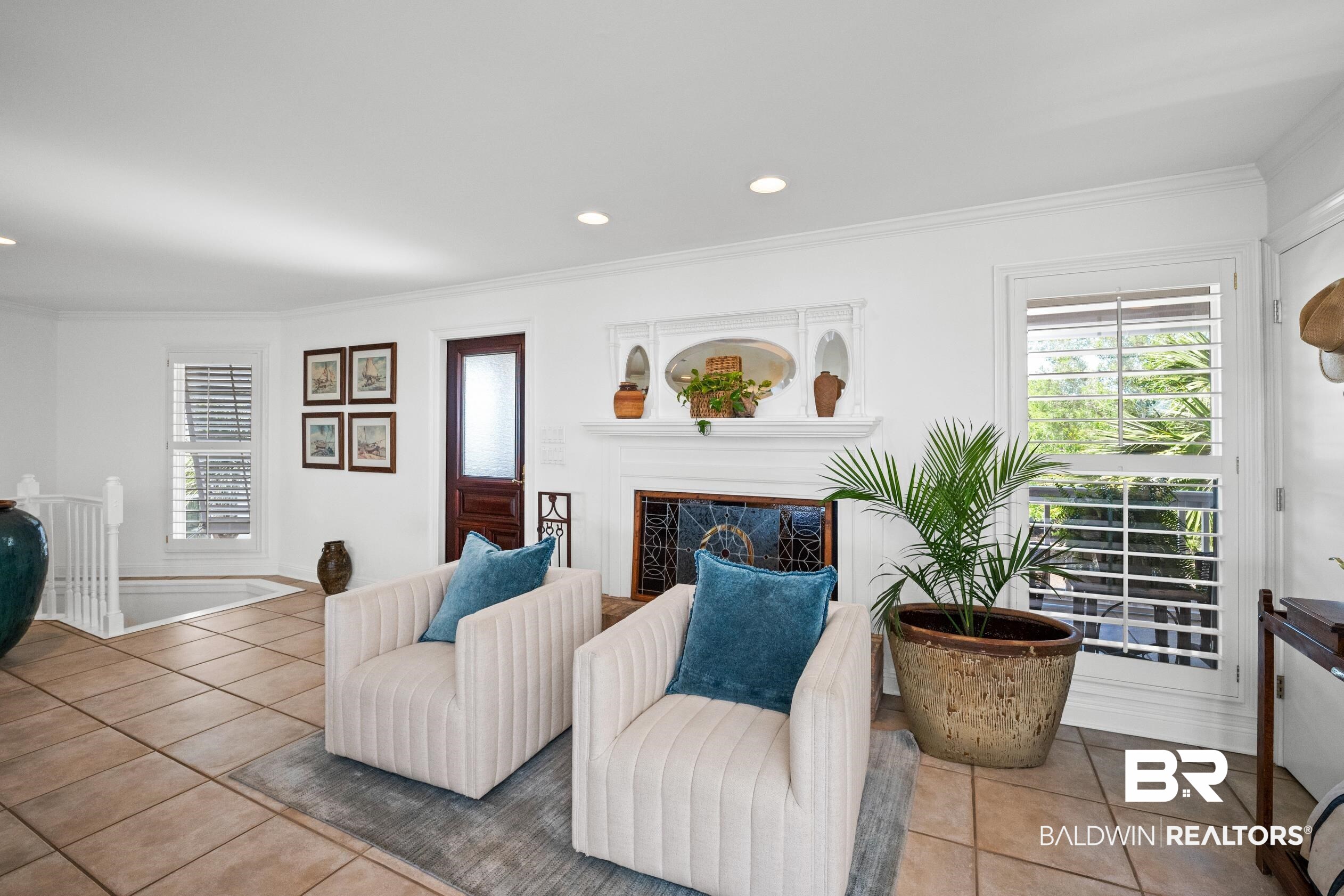 31304 River Road Orange Beach, AL 36561 - Photo 23 of 78 Tiled living room featuring a fireplace, ornamental molding, and recessed lighting