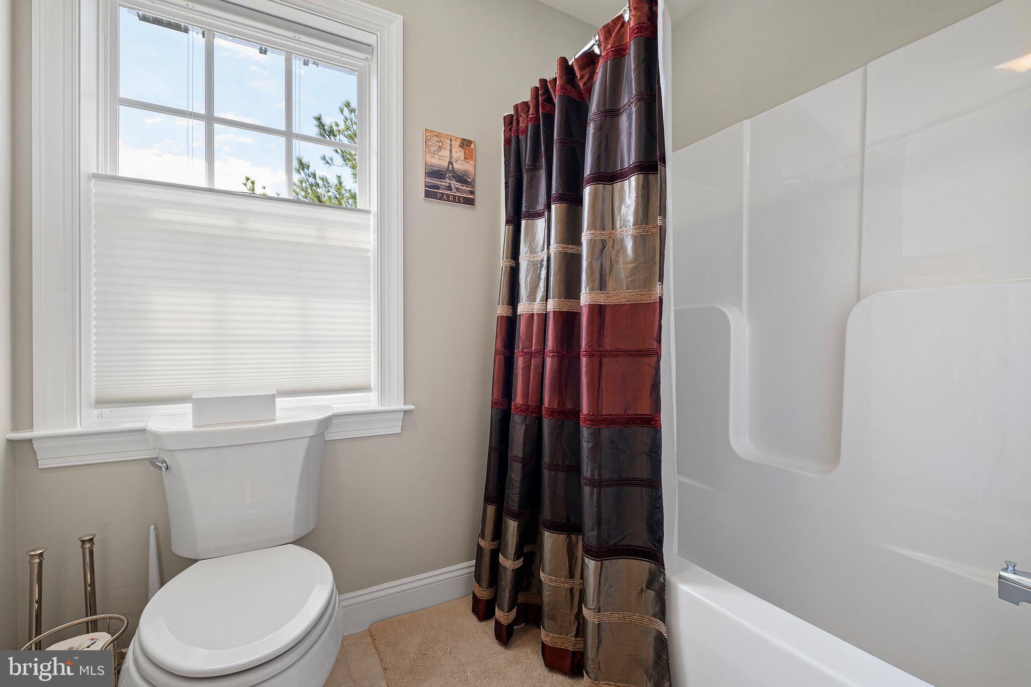513 Valley Road Newark, DE 19711 - Photo 22 of 34 a bathroom with a toilet and a shower