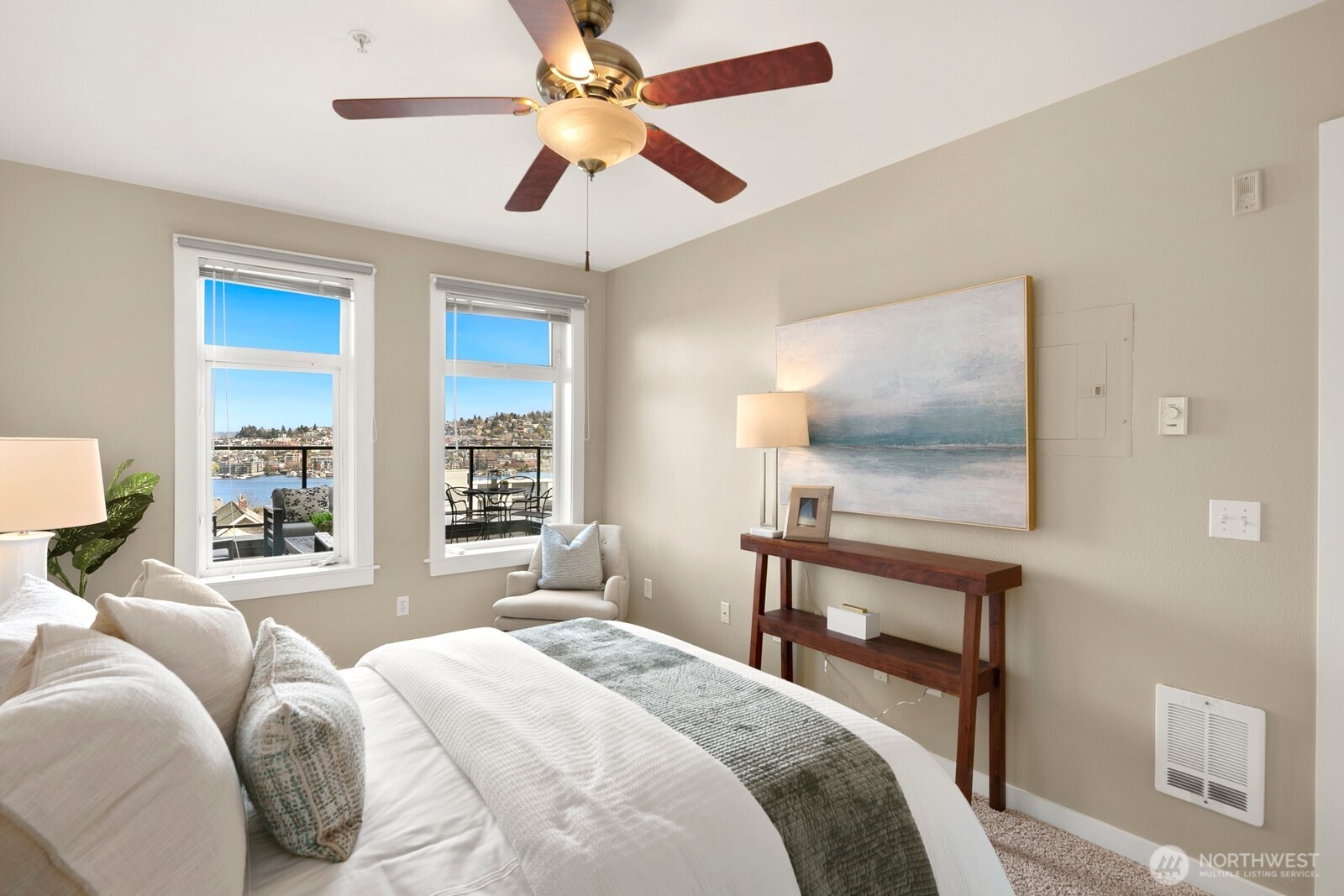 655 Crockett Street, Unit A204 Seattle, WA 98109 - Photo 16 of 23 a bedroom with a bed and a table