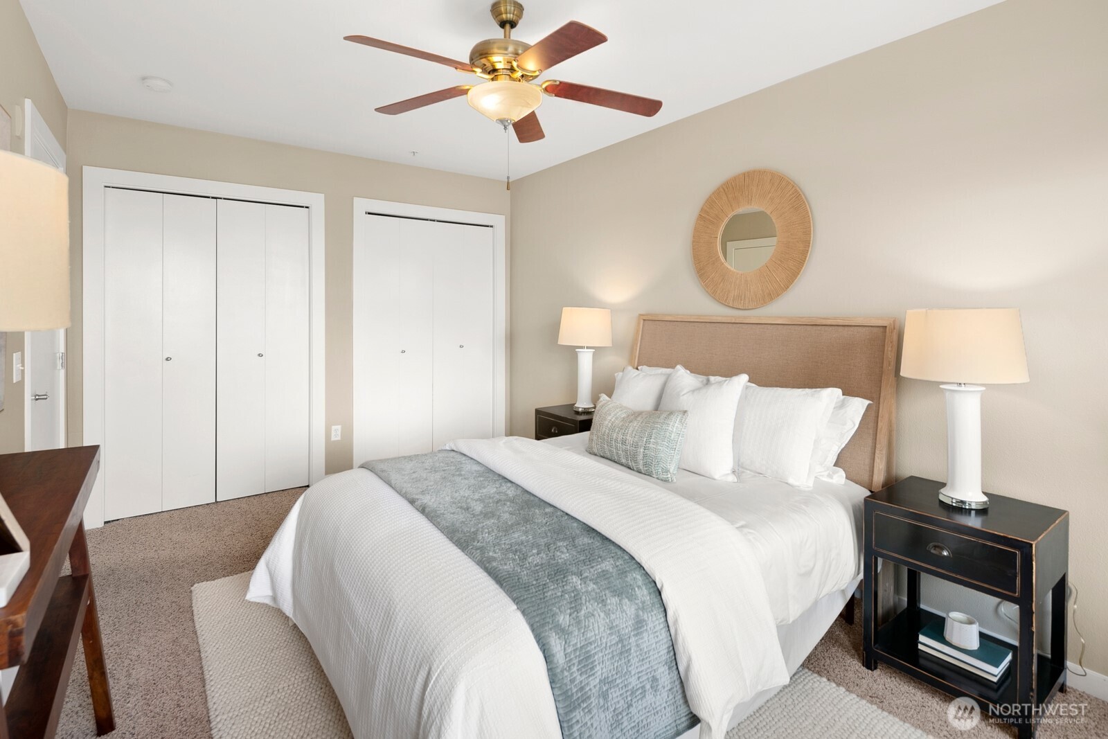 655 Crockett Street, Unit A204 Seattle, WA 98109 - Photo 17 of 23 a bedroom with a bed and a lamp