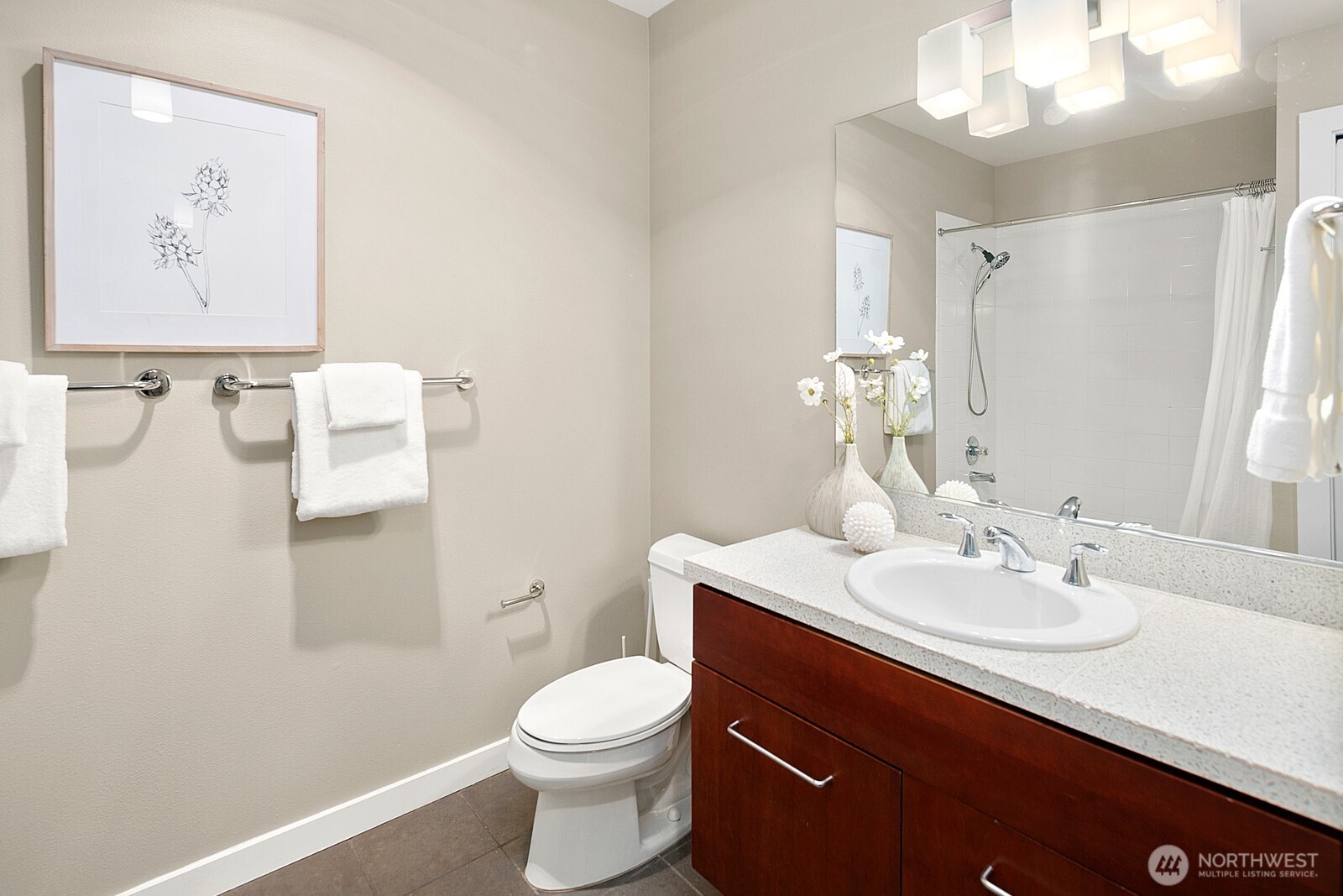 655 Crockett Street, Unit A204 Seattle, WA 98109 - Photo 18 of 23 a bathroom with a sink vanity mirror and toilet