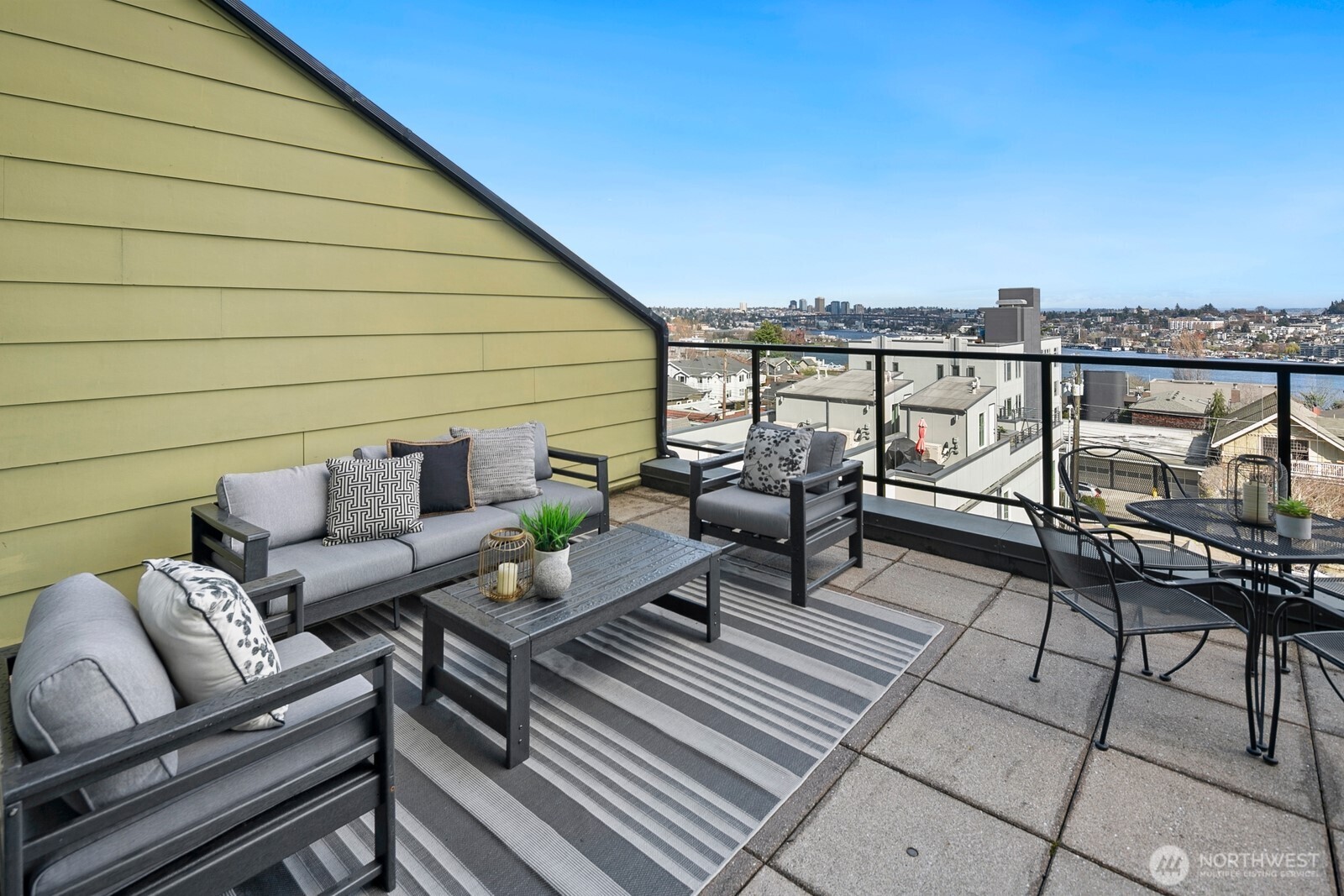 655 Crockett Street, Unit A204 Seattle, WA 98109 - Photo 23 of 23 a terrace with outdoor seating and city view