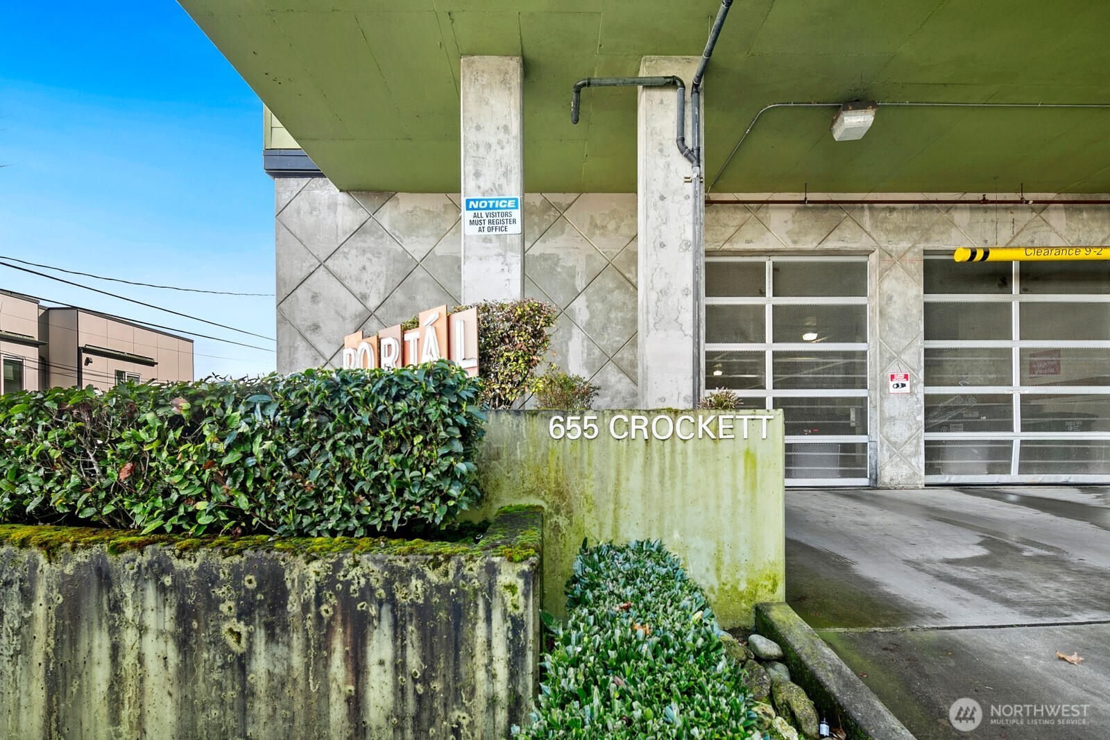 655 Crockett Street, Unit A204 Seattle, WA 98109 - Photo 3 of 23 a front view of a house with a garden