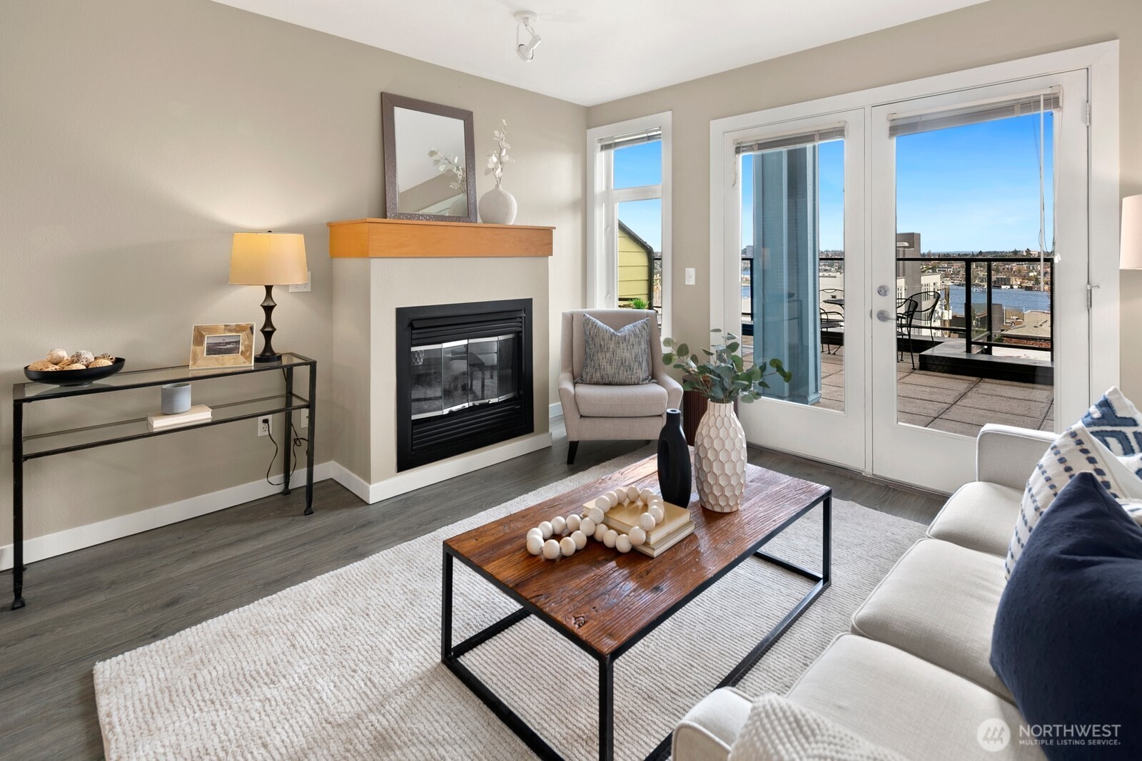 655 Crockett Street, Unit A204 Seattle, WA 98109 - Photo 8 of 23 a living room with furniture and a fireplace