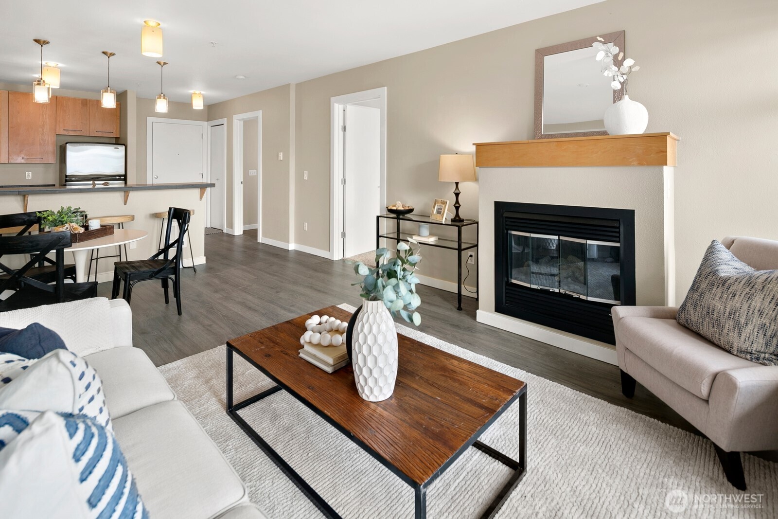 655 Crockett Street, Unit A204 Seattle, WA 98109 - Photo 9 of 23 a living room with furniture and a fireplace