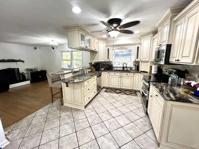 a bedroom with a bed and with furniture