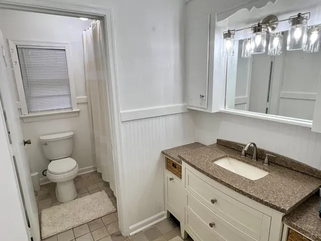 a view of a room with wooden walls