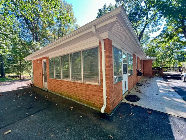 a view of house with trees in the background
