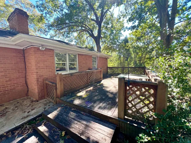 a view of a park with large trees