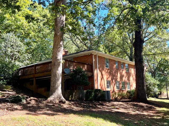 a bathroom with a glass door shower and a sink