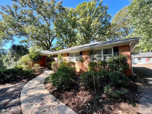 a kitchen with stainless steel appliances a refrigerator sink and cabinets