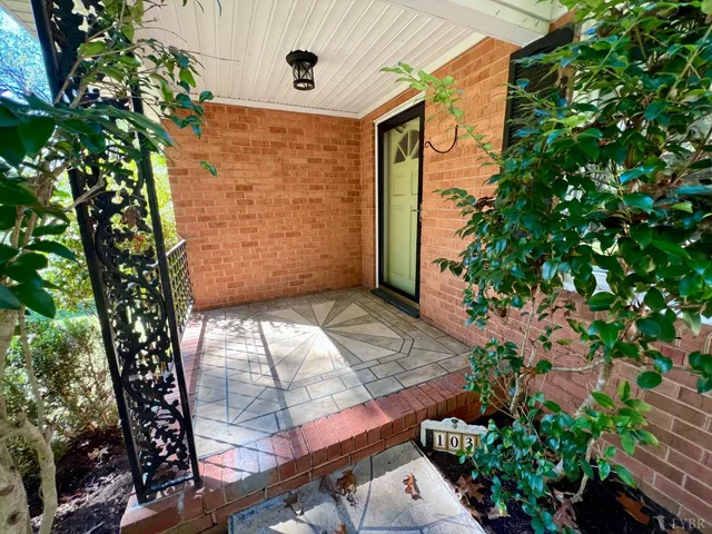 a kitchen with stainless steel appliances granite countertop a stove top oven a sink a dining table and chairs with wooden floor