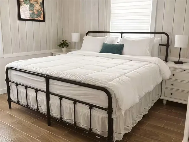 a bedroom with a bed and a dresser