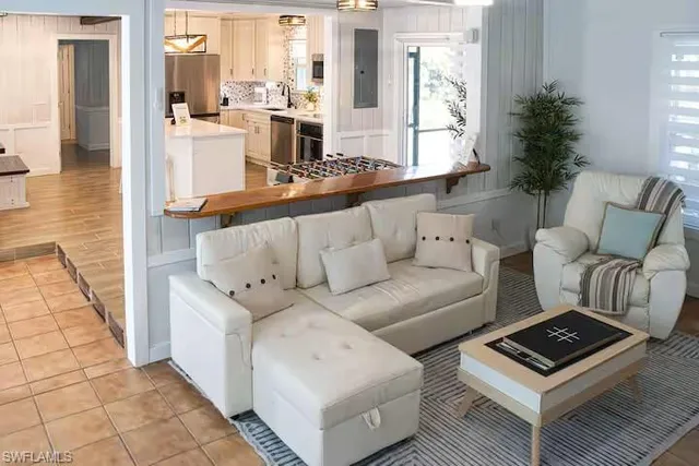 a living room with furniture and a window