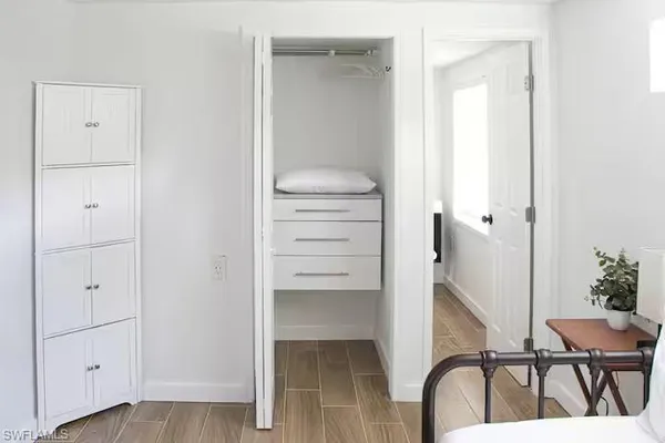 a view of a hallway with seating space