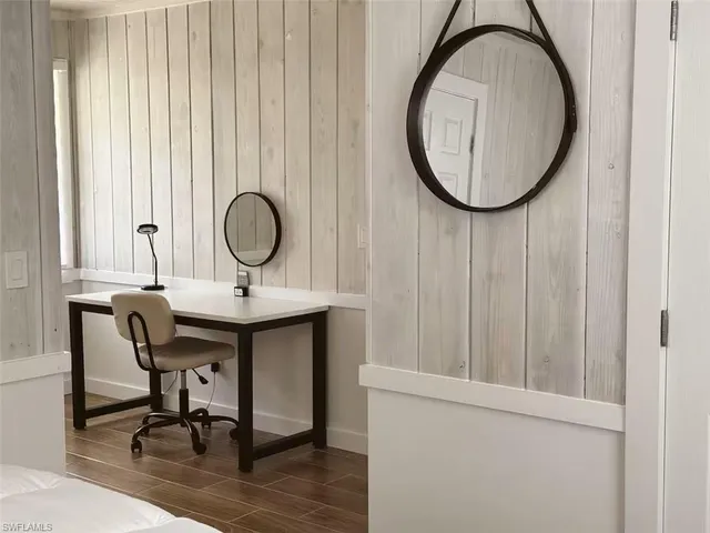 a view of a room that has a table and chair