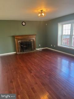 1 Maple Point Drive Langhorne, PA 19047 - Photo 5 of 12 a view of empty room with wooden floor and fireplace