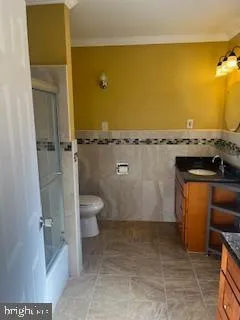 a view of a bathroom with a tub and toilet