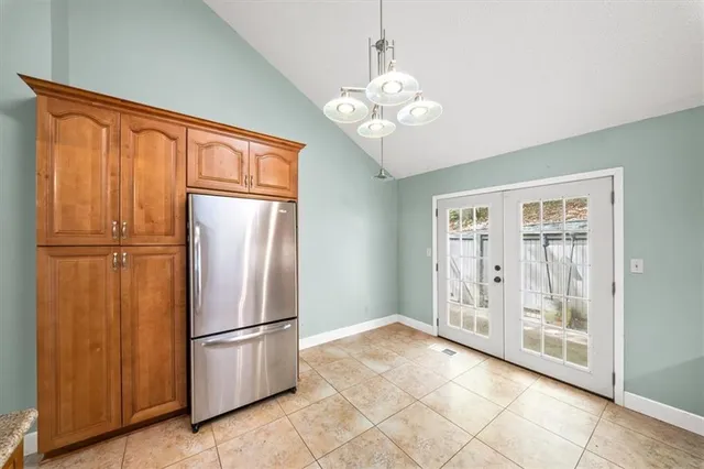 a view of a kitchen with a refrigerator