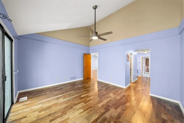 a view of a livingroom with a chandelier fan