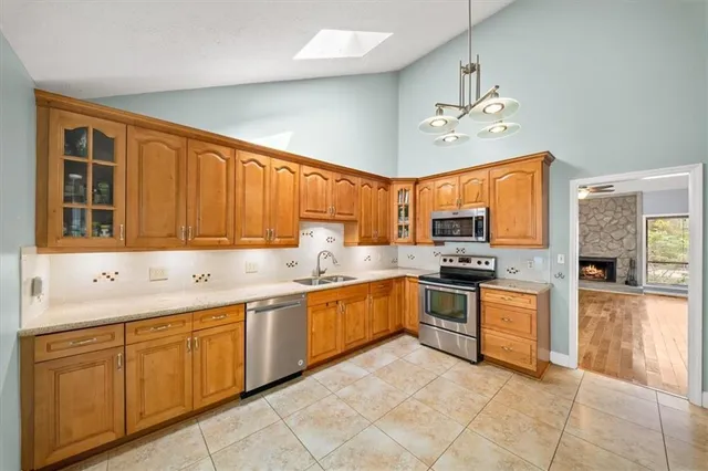 a kitchen with a sink cabinets and window
