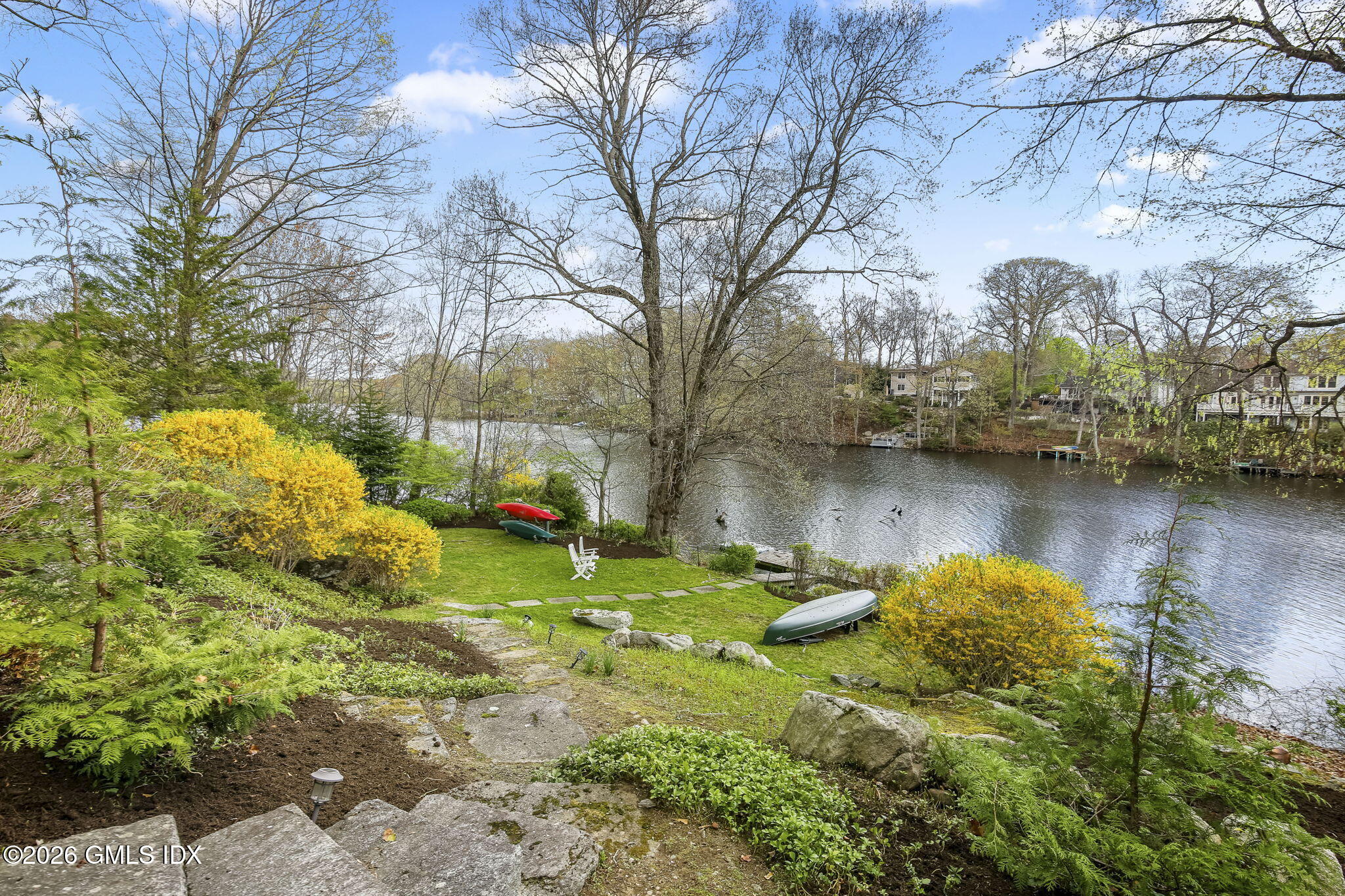 185 Valley Road Cos Cob, CT 06807 - Photo 4 of 38 a backyard of a house with a yard and outdoor seating
