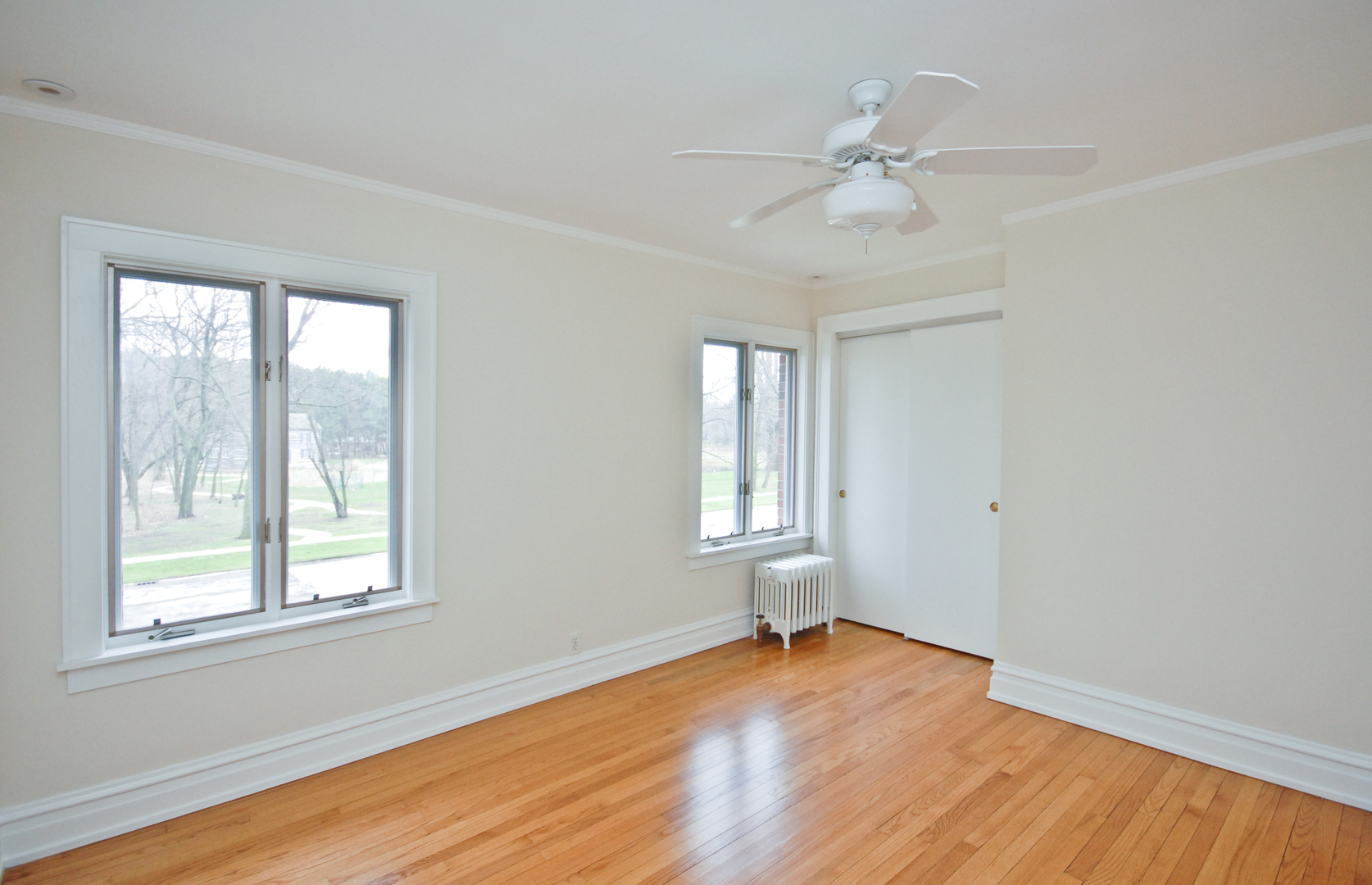 1149 Willow Road Winnetka, IL 60093 - Photo 14 of 14 a view of empty room with wooden floor and fan