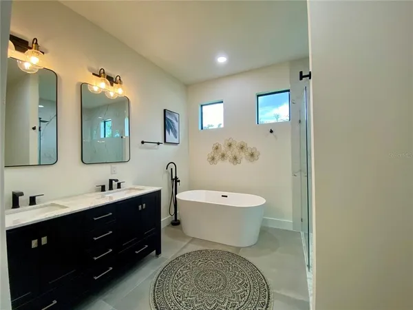 a bathroom with a toilet a sink and bathtub