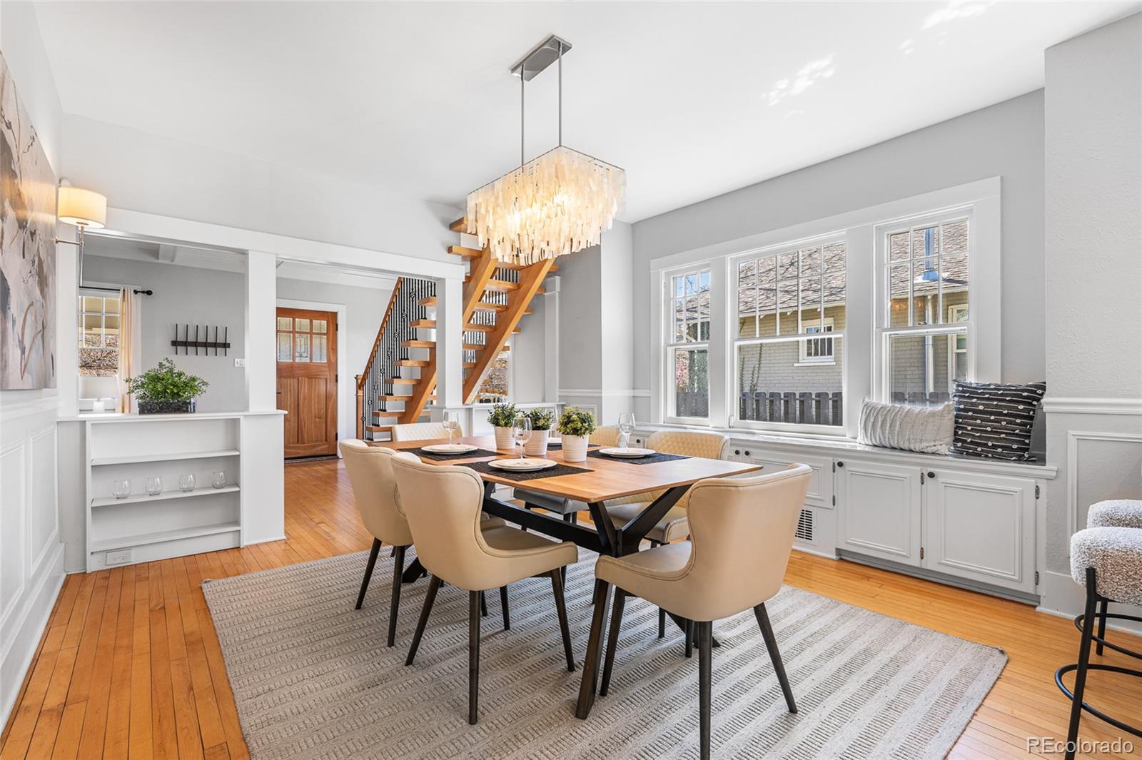 1065 Jackson Street Denver, CO 80206 - Photo 12 of 50 a view of a dining room with furniture window and wooden floor