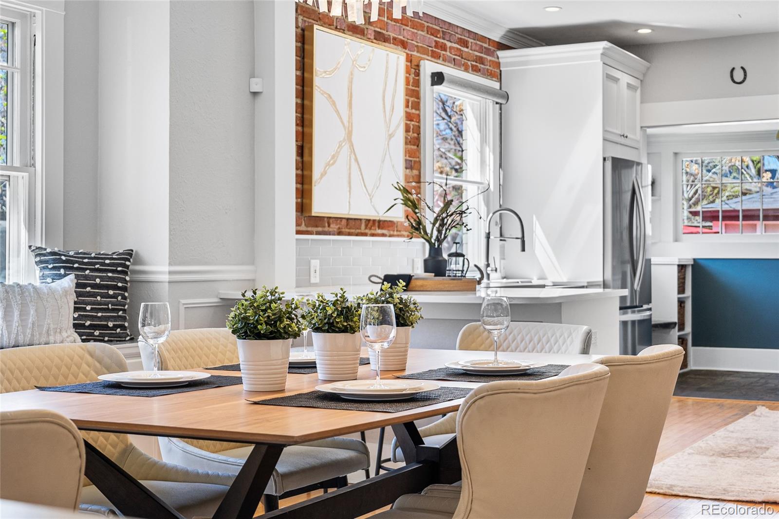 1065 Jackson Street Denver, CO 80206 - Photo 13 of 50 a view of a dining room with furniture window and wooden floor