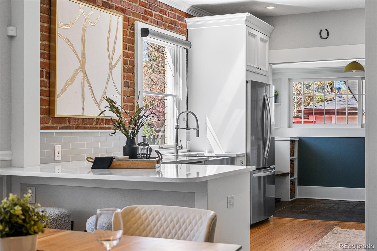 1065 Jackson Street Denver, CO 80206 - Photo 15 of 50 a living room with furniture and a flat screen tv