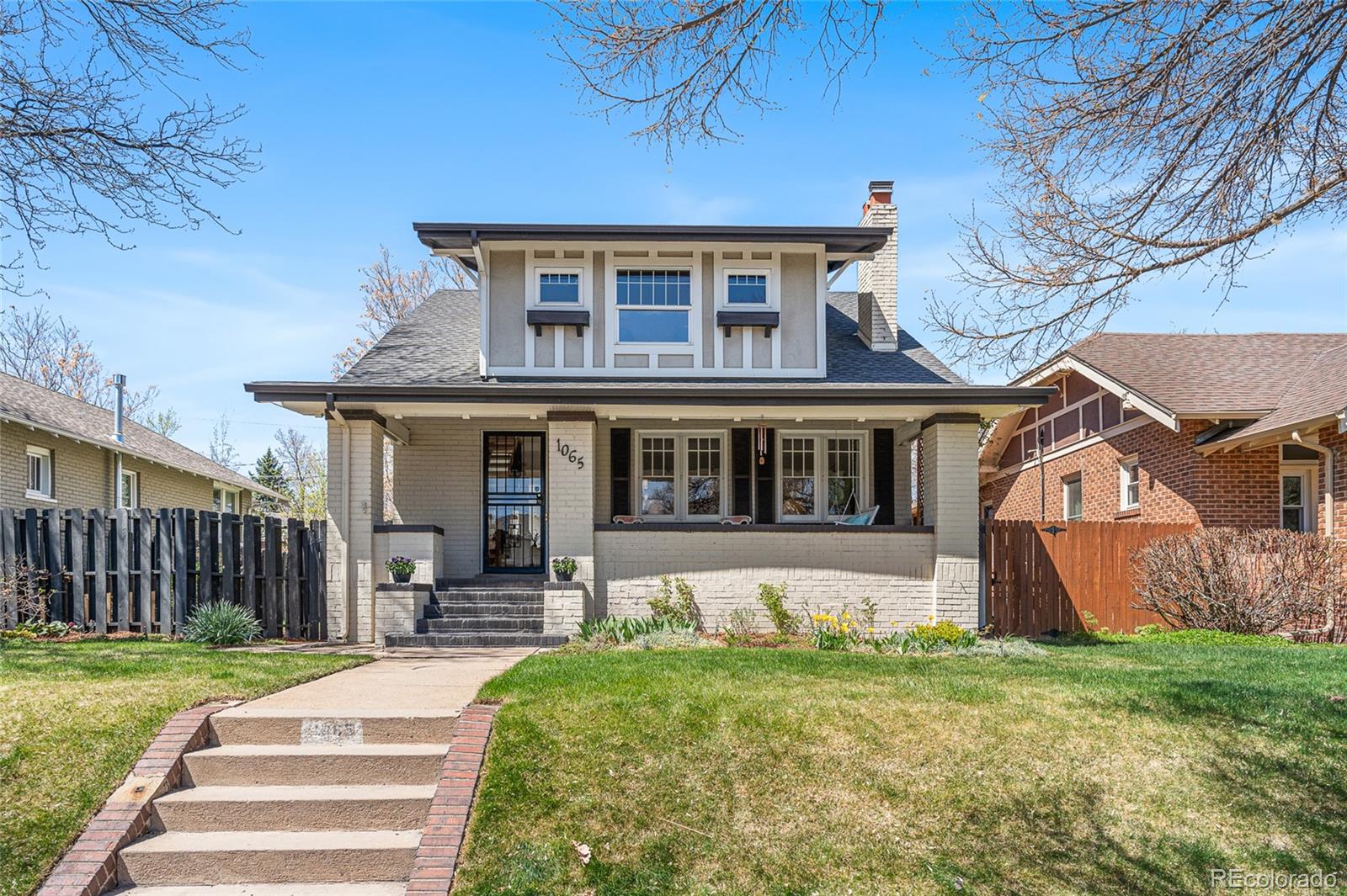 1065 Jackson Street Denver, CO 80206 - Photo 2 of 50 a front view of a house with garden