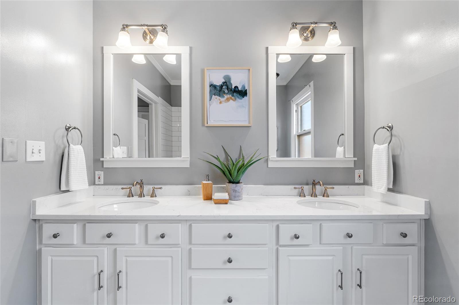 1065 Jackson Street Denver, CO 80206 - Photo 24 of 50 a bathroom with double sink and a mirror