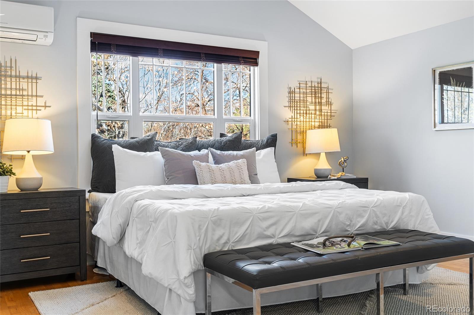 1065 Jackson Street Denver, CO 80206 - Photo 27 of 50 a bedroom with a bed and a window