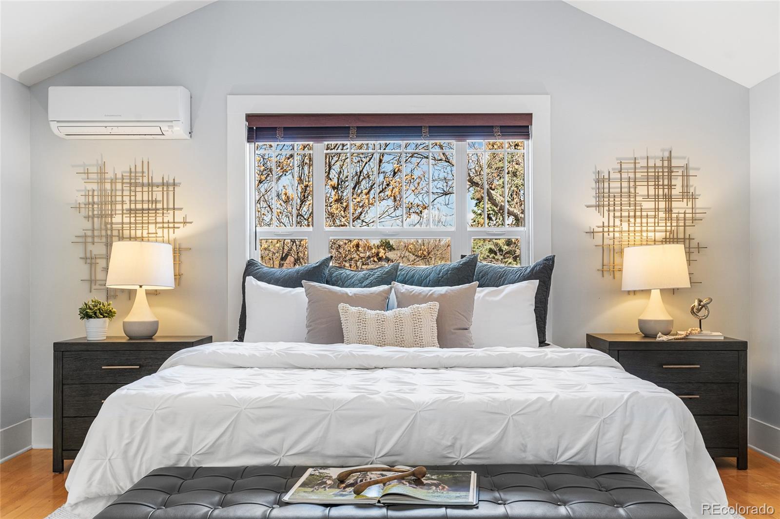 1065 Jackson Street Denver, CO 80206 - Photo 28 of 50 a bedroom with a large bed and a window