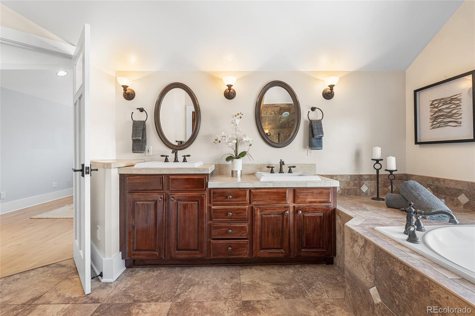 1065 Jackson Street Denver, CO 80206 - Photo 31 of 50 a bathroom with a double vanity sink and a mirror