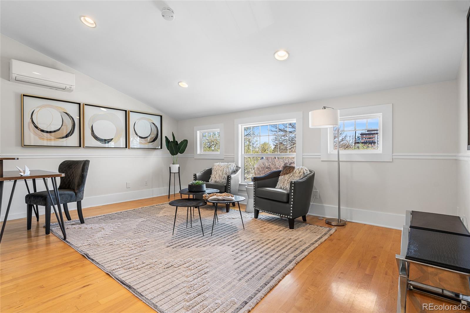 1065 Jackson Street Denver, CO 80206 - Photo 33 of 50 a living room with furniture and a wooden floor